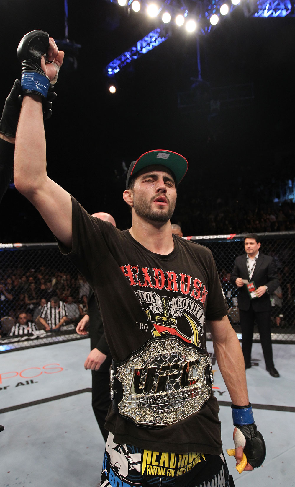LAS VEGAS - FEBRUARY 04:  Carlos Condit receives the interim UFC welterweight championship belt after defeating Nick Diaz during the UFC 143 event at Mandalay Bay Events Center on February 4, 2012 in Las Vegas, Nevada.  (Photo by Nick Laham/Zuffa LLC/Zuffa LLC via Getty Images) *** Local Caption *** Carlos Condit