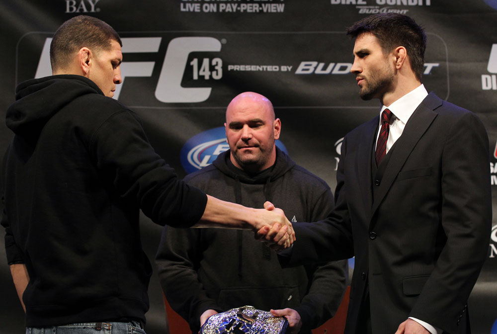LAS VEGAS, NV - FEBRUARY 02: (L-R) Opponents Nick Diaz and Carlos Condit face off during the UFC 143 final pre-fight press conference at the Mandalay Bay Hotel & Casino on February 2, 2012 in Las Vegas, United States. (Photo by Josh Hedges/Zuffa LLC/Zuffa LLC via Getty Images) *** Local Caption *** Nick Diaz; Carlos Condit