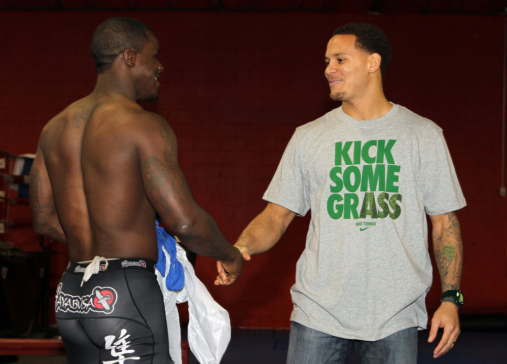 NASHVILLE, TN - JANUARY 18: (R-L) Tennessee Titans defensive back Cortland Finnegan meets UFC fighter Melvin Guillard during the UFC on FX open workouts at the Nashville MMA Gym on January 18, 2012 in Nashville, Tennessee. (Photo by Josh Hedges/Zuffa LLC/Zuffa LLC via Getty Images)
