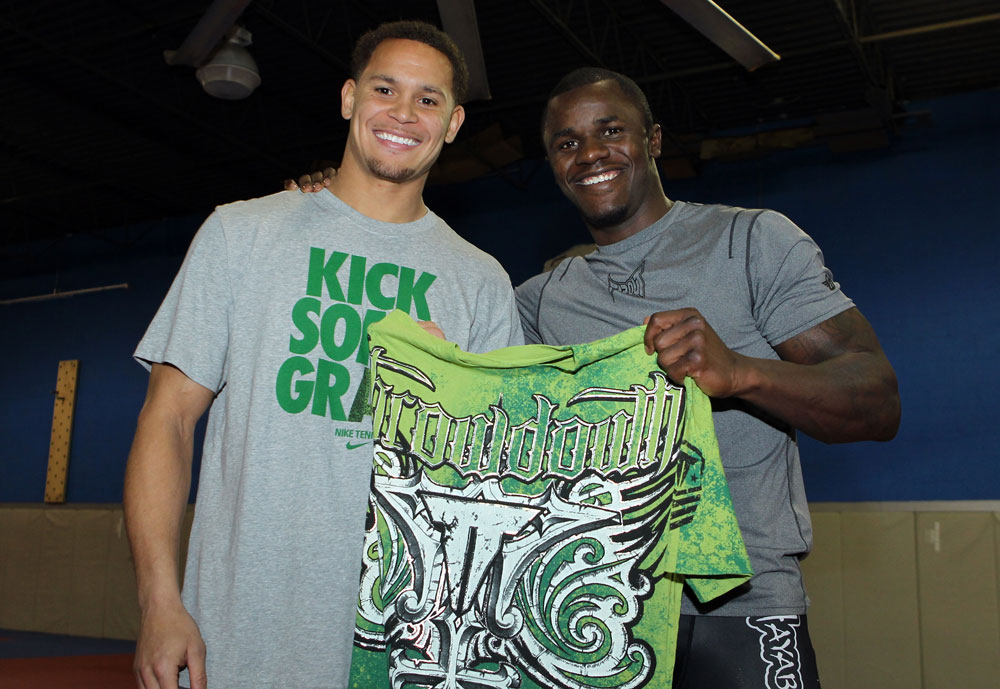 NASHVILLE, TN - JANUARY 18: (L-R) Tennessee Titans defensive back Cortland Finnegan meets UFC fighter Melvin Guillard during the UFC on FX open workouts at the Nashville MMA Gym on January 18, 2012 in Nashville, Tennessee. (Photo by Josh Hedges/Zuffa LLC/Zuffa LLC via Getty Images)