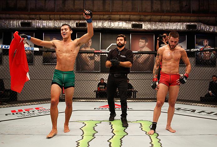 Claudio Puelles celebrates his victory over Marcelo Rojo as he advances to <a href='../event/Ultimate-Fighter-Team-Serra-vs-Team-Hughes-Finale'><a href='../event/The-Ultimate-Fighter-Team-US-vs-Team-UK-FINALE'><a href='../event/The-Ultimate-Fighter-Heavyweights-FINALE'>The Ultimate fighter:</a></a></a> Latin America Finale.