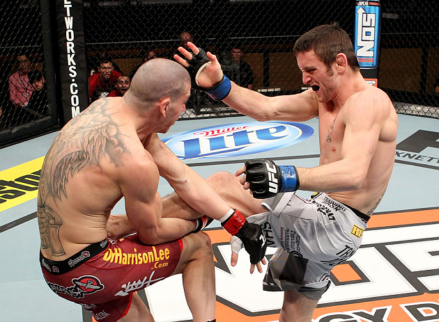 LAS VEGAS, NV - DECEMBER 15:  (R-L) Timothy Elliott kicks Jared Papazian during their flyweight fight at the TUF 16 Finale on December 15, 2012  at the Joint at the Hard Rock in Las Vegas, Nevada.  (Photo by Jim Kemper/Zuffa LLC/Zuffa LLC via Getty Images) *** Local Caption ***Jared Papazian; Timothy Elliott