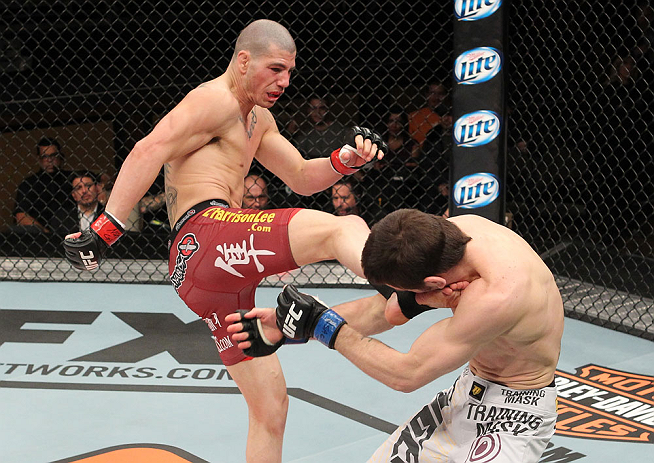 LAS VEGAS, NV - DECEMBER 15: (L-R) Jared Papazian kicks Timothy Elliott during their flyweight fight at the TUF 16 Finale on December 15, 2012 at the Joint at the Hard Rock in Las Vegas, Nevada. (Photo by Jim Kemper/Zuffa LLC/Zuffa LLC via Getty Images) *** Local Caption ***Jared Papazian; Timothy Elliott