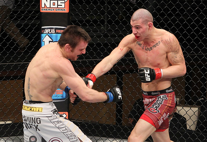LAS VEGAS, NV - DECEMBER 15: (R-L) Jared Papazian punches Timothy Elliott during their flyweight fight at the TUF 16 Finale on December 15, 2012 at the Joint at the Hard Rock in Las Vegas, Nevada. (Photo by Jim Kemper/Zuffa LLC/Zuffa LLC via Getty Images) *** Local Caption ***Jared Papazian; Timothy Elliott