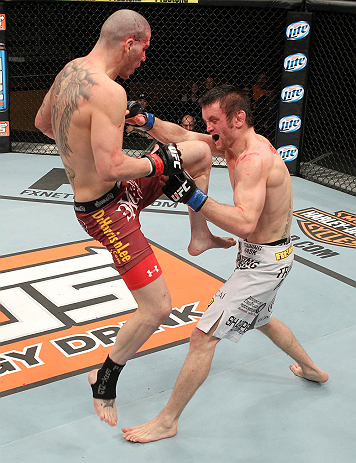 LAS VEGAS, NV - DECEMBER 15: (L-R) Jared Papazian knees Timothy Elliott during their flyweight fight at the TUF 16 Finale on December 15, 2012 at the Joint at the Hard Rock in Las Vegas, Nevada. (Photo by Jim Kemper/Zuffa LLC/Zuffa LLC via Getty Images) *** Local Caption ***Jared Papazian; Timothy Elliott