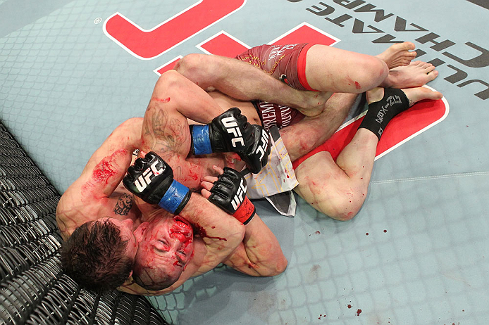 LAS VEGAS, NV - DECEMBER 15: (L-R) Timothy Elliott attempts to submit Jared Papazian during their flyweight fight at the TUF 16 Finale on December 15, 2012 at the Joint at the Hard Rock in Las Vegas, Nevada. (Photo by Jim Kemper/Zuffa LLC/Zuffa LLC via Getty Images) *** Local Caption ***Jared Papazian; Timothy Elliott