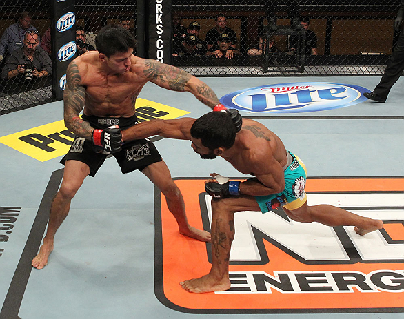 LAS VEGAS, NV - DECEMBER 15: (R-L) Hugo Viana punches Reuben Duran during their bantamweight fight at the TUF 16 Finale on December 15, 2012 at the Joint at the Hard Rock in Las Vegas, Nevada. (Photo by Jim Kemper/Zuffa LLC/Zuffa LLC via Getty Images) *** Local Caption *** Hugo Viana; Reuben Duran