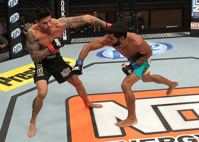 LAS VEGAS, NV - DECEMBER 15: (R-L) Hugo Viana punches Reuben Duran during their bantamweight fight at the TUF 16 Finale on December 15, 2012 at the Joint at the Hard Rock in Las Vegas, Nevada. (Photo by Jim Kemper/Zuffa LLC/Zuffa LLC via Getty Images) *** Local Caption *** Hugo Viana; Reuben Duran