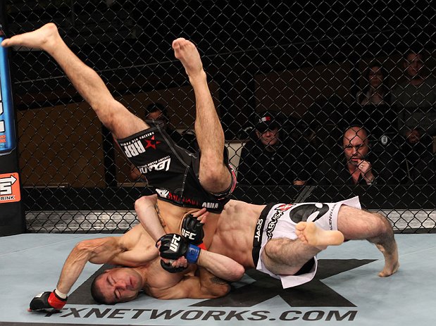 LAS VEGAS, NV - DECEMBER 15: Rustam Khabilov (white shorts) slams Vinc Pichel during their lightweight fight at the TUF 16 Finale on December 15, 2012 at the Joint at the Hard Rock in Las Vegas, Nevada. (Photo by Jim Kemper/Zuffa LLC/Zuffa LLC via Getty Images) *** Local Caption *** Vinc Pichel; Rustam Khabilov