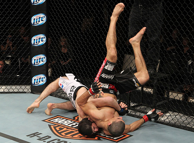 LAS VEGAS, NV - DECEMBER 15: (L-R) Rustam Khabilov slams Vinc Pichel during their lightweight fight at the TUF 16 Finale on December 15, 2012 at the Joint at the Hard Rock in Las Vegas, Nevada. (Photo by Jim Kemper/Zuffa LLC/Zuffa LLC via Getty Images) *** Local Caption *** Vinc Pichel; Rustam Khabilov