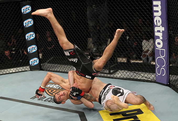 LAS VEGAS, NV - DECEMBER 15: Rustam Khabilov (white shorts) slams Vinc Pichel during their lightweight fight at the TUF 16 Finale on December 15, 2012 at the Joint at the Hard Rock in Las Vegas, Nevada. (Photo by Jim Kemper/Zuffa LLC/Zuffa LLC via Getty Images) *** Local Caption *** Vinc Pichel; Rustam Khabilov