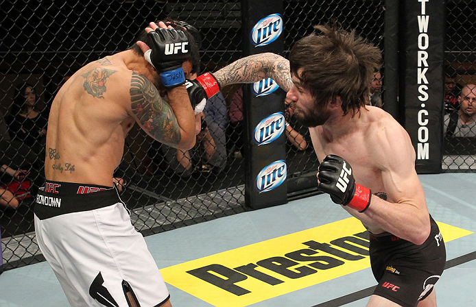 LAS VEGAS, NV - DECEMBER 15: (R-L) Johnny Bedford punches Marcos Vinicius during their bantamweight fight at the TUF 16 Finale on December 15, 2012 at the Joint at the Hard Rock in Las Vegas, Nevada. (Photo by Jim Kemper/Zuffa LLC/Zuffa LLC via Getty Images) *** Local Caption *** Johny Bedford; Marcos Vinicius