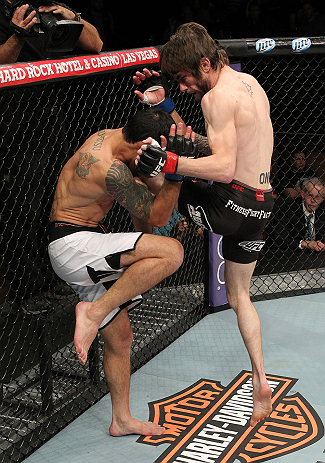 LAS VEGAS, NV - DECEMBER 15: (R-L) Johnny Bedford knees Marcos Vinicius during their bantamweight fight at the TUF 16 Finale on December 15, 2012 at the Joint at the Hard Rock in Las Vegas, Nevada. (Photo by Jim Kemper/Zuffa LLC/Zuffa LLC via Getty Images) *** Local Caption *** Johny Bedford; Marcos Vinicius