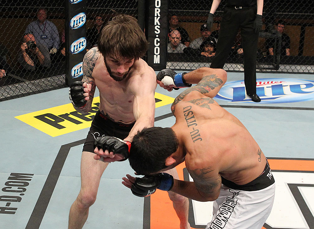 LAS VEGAS, NV - DECEMBER 15: (L-R) Johnny Bedford punches Marcos Vinicius during their bantamweight fight at the TUF 16 Finale on December 15, 2012 at the Joint at the Hard Rock in Las Vegas, Nevada. (Photo by Jim Kemper/Zuffa LLC/Zuffa LLC via Getty Images) *** Local Caption *** Johny Bedford; Marcos Vinicius