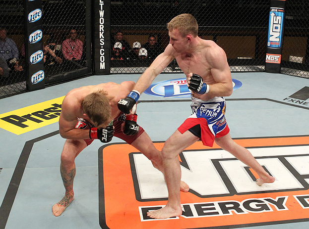 LAS VEGAS, NV - DECEMBER 15: (R-L) James Head punches Mike Pyle during their welterweight fight at the TUF 16 Finale on December 15, 2012 at the Joint at the Hard Rock in Las Vegas, Nevada. (Photo by Jim Kemper/Zuffa LLC/Zuffa LLC via Getty Images) *** Local Caption *** Mike Pyle; James Head