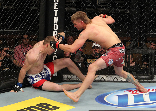 LAS VEGAS, NV - DECEMBER 15: (R-L) Mike Pyle punches James Head during their welterweight fight at the TUF 16 Finale on December 15, 2012 at the Joint at the Hard Rock in Las Vegas, Nevada. (Photo by Jim Kemper/Zuffa LLC/Zuffa LLC via Getty Images) *** Local Caption *** Mike Pyle; James Head