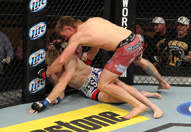 LAS VEGAS, NV - DECEMBER 15: (R-L) Mike Pyle punches James Head during their welterweight fight at the TUF 16 Finale on December 15, 2012 at the Joint at the Hard Rock in Las Vegas, Nevada. (Photo by Jim Kemper/Zuffa LLC/Zuffa LLC via Getty Images) *** Local Caption *** Mike Pyle; James Head