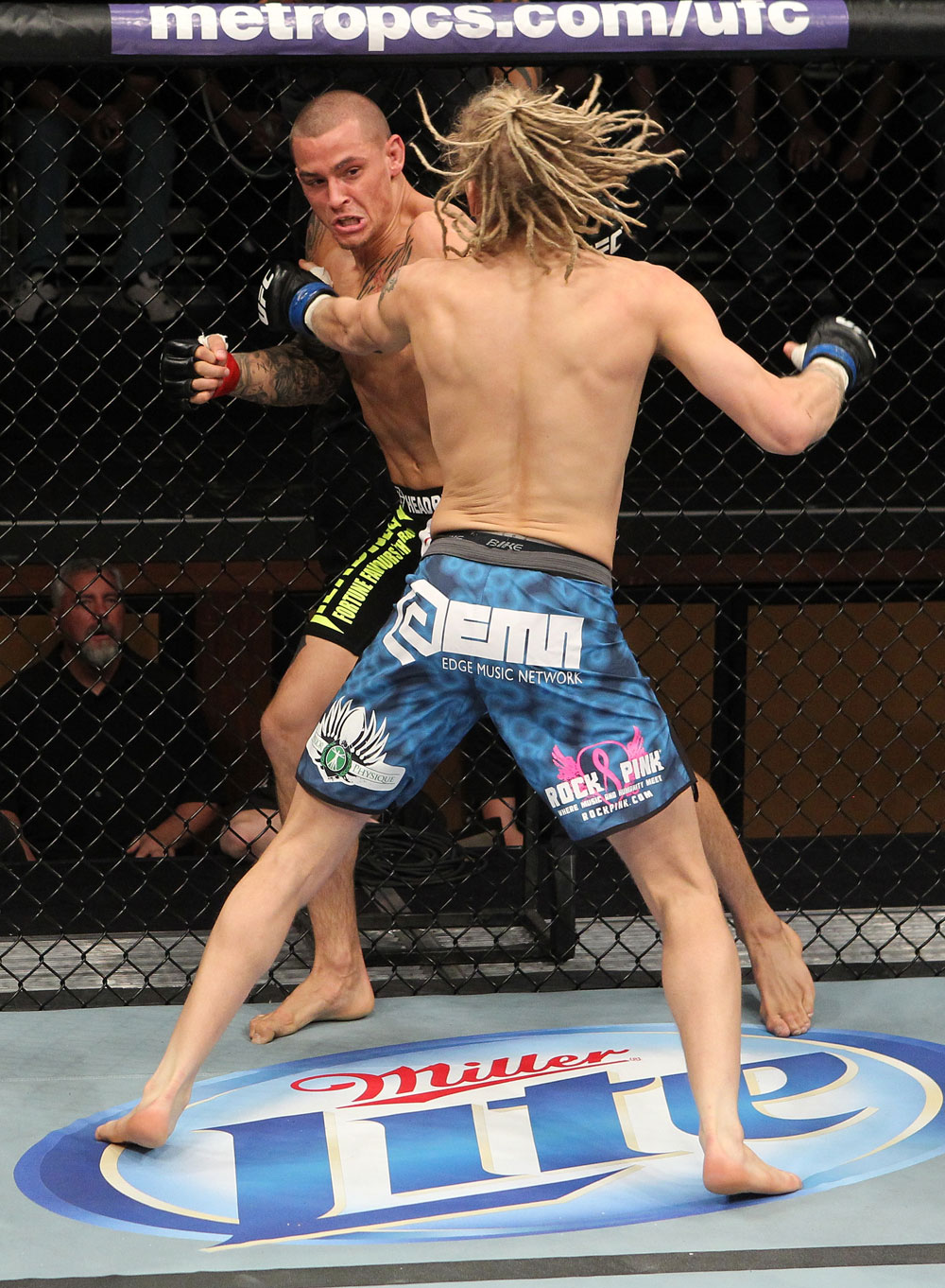 LAS VEGAS, NV - DECEMBER 15: Dustin Poirier (black shorts) and Jonathan Poirier (blue shorts) exchange punches during their featherweight fight at the TUF 16 Finale on December 15, 2012 at the Joint at the Hard Rock in Las Vegas, Nevada. (Photo by Jim Kemper/Zuffa LLC/Zuffa LLC via Getty Images) *** Local Caption *** Dustn Poirier; Jonathan Brookins