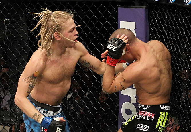 LAS VEGAS, NV - DECEMBER 15: (L-R) Jonathan Brookins punches Dustin Poirier during their featherweight fight at the TUF 16 Finale on December 15, 2012 at the Joint at the Hard Rock in Las Vegas, Nevada. (Photo by Jim Kemper/Zuffa LLC/Zuffa LLC via Getty Images) *** Local Caption *** Dustn Poirier; Jonathan Brookins