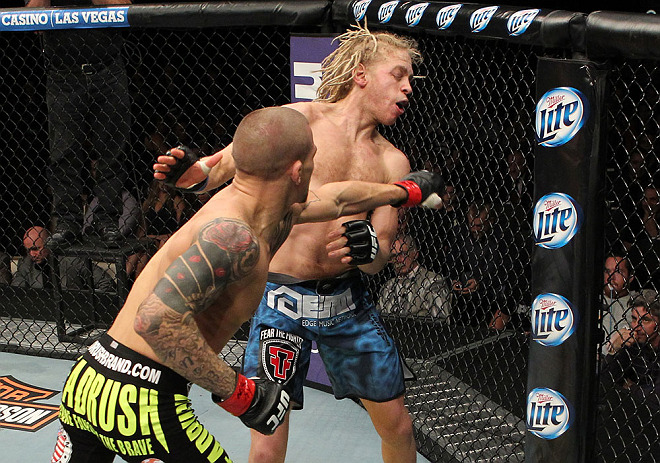 LAS VEGAS, NV - DECEMBER 15: (L-R) Dustin Poirier punches Jonathan Brookins during their featherweight fight at the TUF 16 Finale on December 15, 2012 at the Joint at the Hard Rock in Las Vegas, Nevada. (Photo by Jim Kemper/Zuffa LLC/Zuffa LLC via Getty Images) *** Local Caption *** Dustn Poirier; Jonathan Brookins