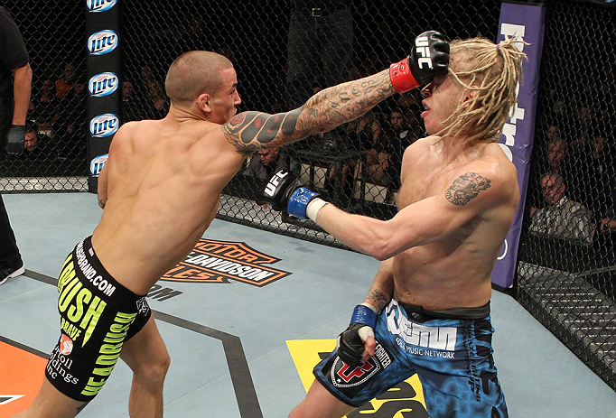 LAS VEGAS, NV - DECEMBER 15: (L-R) Dustin Poirier punches Jonathan Brookins during their featherweight fight at the TUF 16 Finale on December 15, 2012 at the Joint at the Hard Rock in Las Vegas, Nevada. (Photo by Jim Kemper/Zuffa LLC/Zuffa LLC via Getty Images) *** Local Caption *** Dustn Poirier; Jonathan Brookins
