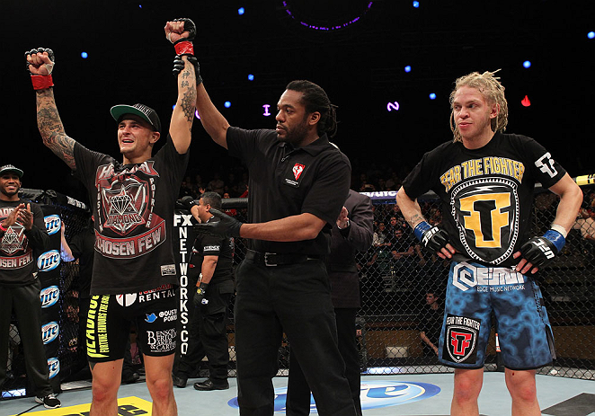 LAS VEGAS, NV - DECEMBER 15: Dustin Poirier (left) reacts to being declared the winner in his fight against Jonathan Brookins (right) during their featherweight fight at the TUF 16 Finale on December 15, 2012 at the Joint at the Hard Rock in Las Vegas, Nevada. (Photo by Jim Kemper/Zuffa LLC/Zuffa LLC via Getty Images) *** Local Caption *** Dustn Poirier; Jonathan Brookins