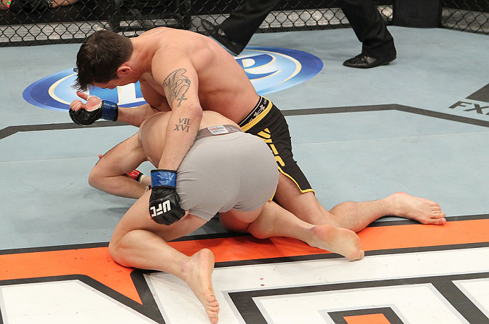 LAS VEGAS, NV - DECEMBER 15: Mike Ricci (top) elbows Colton Smith (bottom) during their lightweight fight at the TUF 16 Finale on December 15, 2012 at the Joint at the Hard Rock in Las Vegas, Nevada. (Photo by Jim Kemper/Zuffa LLC/Zuffa LLC via Getty Images) *** Local Caption *** Colton Smith; Mike Ricci