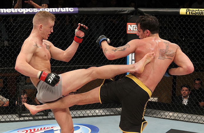 LAS VEGAS, NV - DECEMBER 15: (L-R) Colton Smith and Mike Ricci exchange kicks during their lightweight fight at the TUF 16 Finale on December 15, 2012 at the Joint at the Hard Rock in Las Vegas, Nevada. (Photo by Jim Kemper/Zuffa LLC/Zuffa LLC via Getty Images) *** Local Caption *** Colton Smith; Mike Ricci