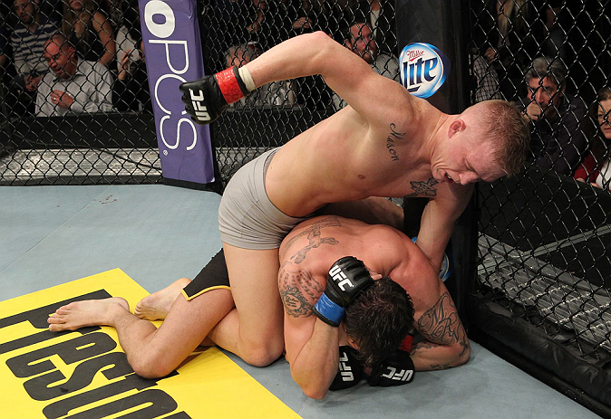 LAS VEGAS, NV - DECEMBER 15: Colton Smith (top) punches Mike Ricci during their lightweight fight at the TUF 16 Finale on December 15, 2012 at the Joint at the Hard Rock in Las Vegas, Nevada. (Photo by Jim Kemper/Zuffa LLC/Zuffa LLC via Getty Images) *** Local Caption *** Colton Smith; Mike Ricci