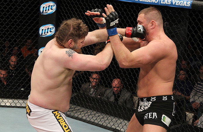 LAS VEGAS, NV - DECEMBER 15: (L-R) Roy Nelson punches Matt Mitrione during their heavyweight fight at the TUF 16 Finale on December 15, 2012 at the Joint at the Hard Rock in Las Vegas, Nevada. (Photo by Jim Kemper/Zuffa LLC/Zuffa LLC via Getty Images) *** Local Caption *** Roy Nelson; Matt Mitrione