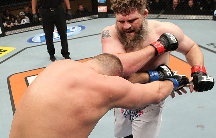 LAS VEGAS, NV - DECEMBER 15: (R-L) Roy Nelson punches Matt Mitrione during their heavyweight fight at the TUF 16 Finale on December 15, 2012 at the Joint at the Hard Rock in Las Vegas, Nevada. (Photo by Jim Kemper/Zuffa LLC/Zuffa LLC via Getty Images) *** Local Caption *** Roy Nelson; Matt Mitrione
