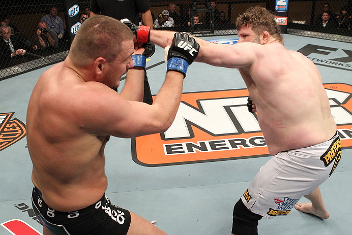 LAS VEGAS, NV - DECEMBER 15: (R-L) Roy Nelson punches Matt Mitrione during their heavyweight fight at the TUF 16 Finale on December 15, 2012 at the Joint at the Hard Rock in Las Vegas, Nevada. (Photo by Jim Kemper/Zuffa LLC/Zuffa LLC via Getty Images) *** Local Caption *** Roy Nelson; Matt Mitrione