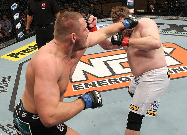LAS VEGAS, NV - DECEMBER 15: (L-R) Matt Mitrione punches Roy Nelson during their heavyweight fight at the TUF 16 Finale on December 15, 2012 at the Joint at the Hard Rock in Las Vegas, Nevada. (Photo by Jim Kemper/Zuffa LLC/Zuffa LLC via Getty Images) *** Local Caption *** Roy Nelson; Matt Mitrione