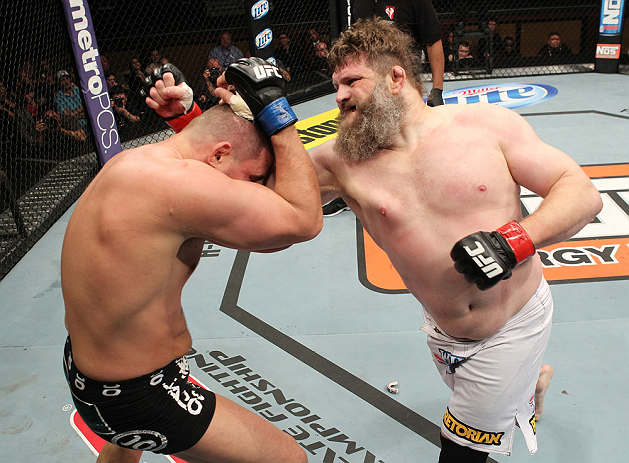 LAS VEGAS, NV - DECEMBER 15: (R-L) Roy Nelson punches Matt Mitrione during their heavyweight fight at the TUF 16 Finale on December 15, 2012 at the Joint at the Hard Rock in Las Vegas, Nevada. (Photo by Jim Kemper/Zuffa LLC/Zuffa LLC via Getty Images) *** Local Caption *** Roy Nelson; Matt Mitrione