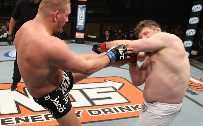 LAS VEGAS, NV - DECEMBER 15: (L-R) Matt Mitrione kicks Roy Nelson during their heavyweight fight at the TUF 16 Finale on December 15, 2012 at the Joint at the Hard Rock in Las Vegas, Nevada. (Photo by Jim Kemper/Zuffa LLC/Zuffa LLC via Getty Images) *** Local Caption *** Roy Nelson; Matt Mitrione