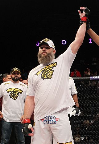 LAS VEGAS, NV - DECEMBER 15: Roy Nelson reacts to being declared the winner over Matt Mitrione during their heavyweight fight at the TUF 16 Finale on December 15, 2012 at the Joint at the Hard Rock in Las Vegas, Nevada. (Photo by Jim Kemper/Zuffa LLC/Zuffa LLC via Getty Images) *** Local Caption *** Roy Nelson; Shane Carwin