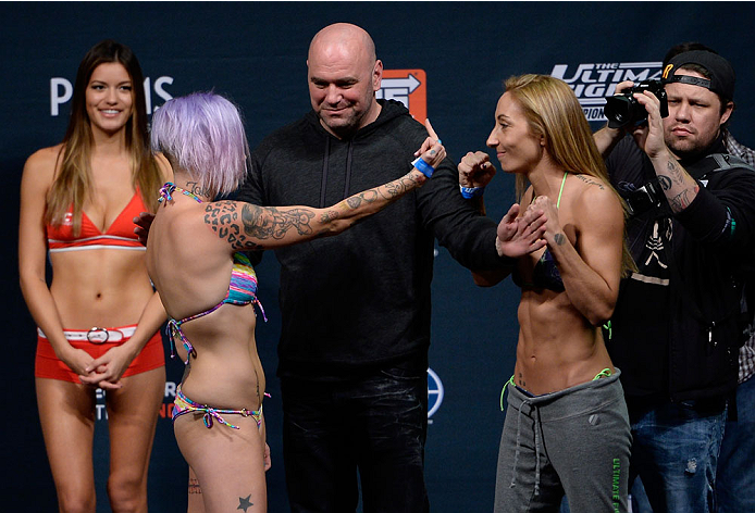 (L-R) UFC strawweights Bec Rawlings gestures to Heather Jo Clark as they fa...