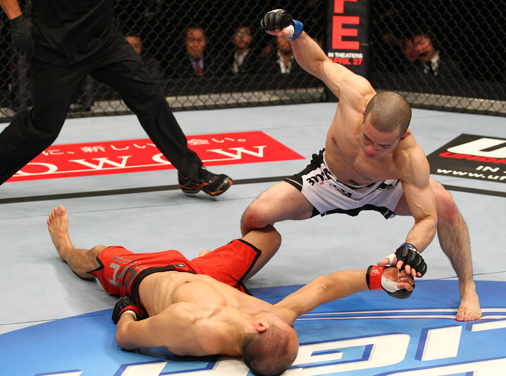 SAITAMA, JAPAN - FEBRUARY 26:  (R-L) Issei Tamura knocks out Tiequan Zhang with a punch on the ground during the UFC 144 event at Saitama Super Arena on February 26, 2012 in Saitama, Japan.  (Photo by Al Bello/Zuffa LLC/Zuffa LLC via Getty Images) *** Local Caption *** Tiequan Zhang; Issei Tamura