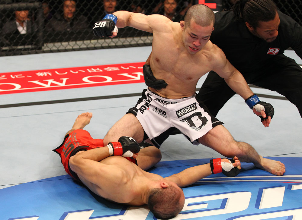 SAITAMA, JAPAN - FEBRUARY 26:  (R-L) Issei Tamura knocks out Tiequan Zhang with a punch on the ground during the UFC 144 event at Saitama Super Arena on February 26, 2012 in Saitama, Japan.  (Photo by Al Bello/Zuffa LLC/Zuffa LLC via Getty Images) *** Local Caption *** Tiequan Zhang; Issei Tamura