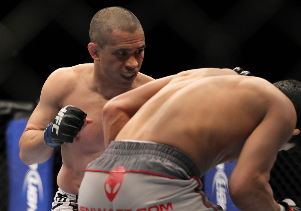 SAITAMA, JAPAN - FEBRUARY 26:  (L-R) Chris Cariaso punches Takeya Mizugaki during the UFC 144 event at Saitama Super Arena on February 26, 2012 in Saitama, Japan.  (Photo by Josh Hedges/Zuffa LLC/Zuffa LLC via Getty Images) *** Local Caption *** Takeya Mizugaki; Chris Cariaso