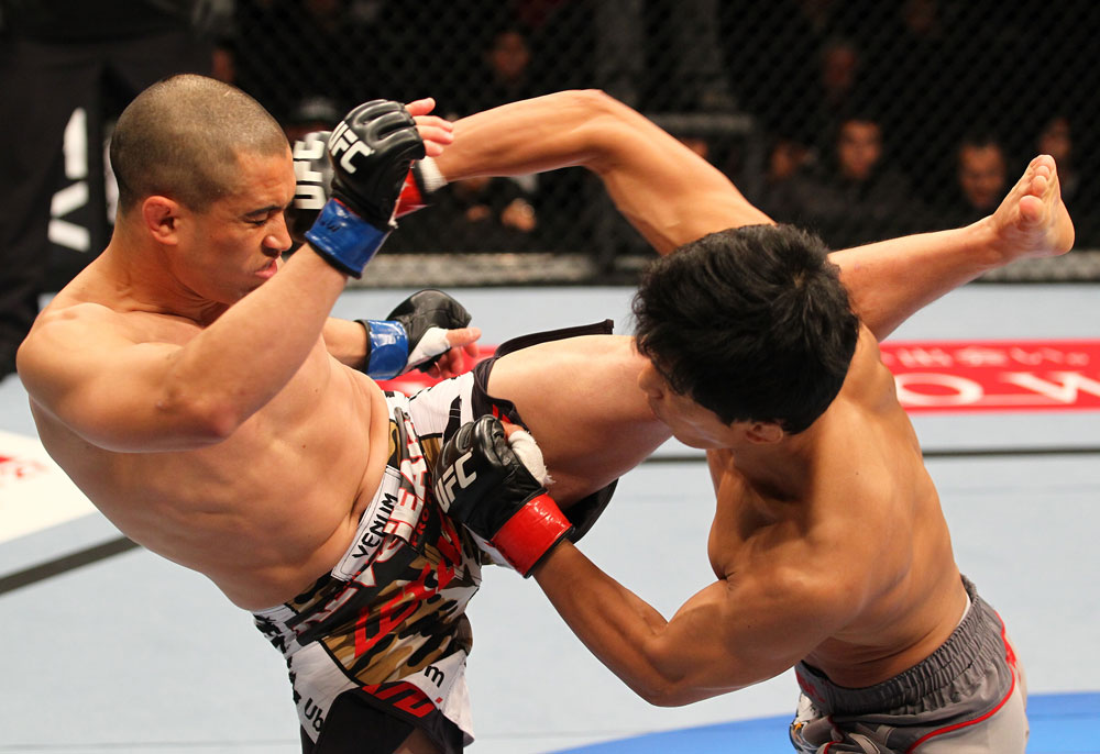 SAITAMA, JAPAN - FEBRUARY 26:  (L-R) Chris Cariaso and Takeya Mizugaki trade strikes during the UFC 144 event at Saitama Super Arena on February 26, 2012 in Saitama, Japan.  (Photo by Al Bello/Zuffa LLC/Zuffa LLC via Getty Images) *** Local Caption *** Takeya Mizugaki; Chris Cariaso