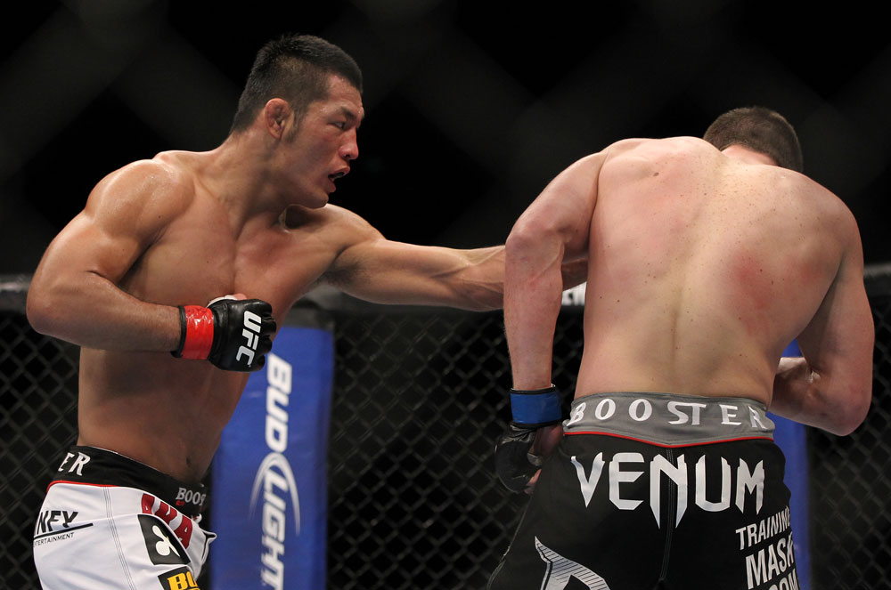 SAITAMA, JAPAN - FEBRUARY 26:  (L-R) RIki Fukuda punches Steve Cantwell during the UFC 144 event at Saitama Super Arena on February 26, 2012 in Saitama, Japan.  (Photo by Josh Hedges/Zuffa LLC/Zuffa LLC via Getty Images) *** Local Caption *** Riki Fukuda; Steve Cantwell