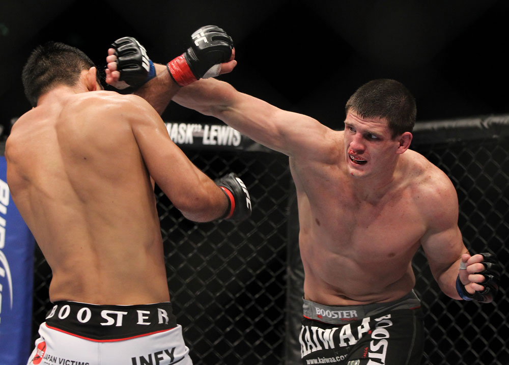 SAITAMA, JAPAN - FEBRUARY 26:  (R-L) Steve Cantwell punches Riki Fukuda during the UFC 144 event at Saitama Super Arena on February 26, 2012 in Saitama, Japan.  (Photo by Josh Hedges/Zuffa LLC/Zuffa LLC via Getty Images) *** Local Caption *** Riki Fukuda; Steve Cantwell