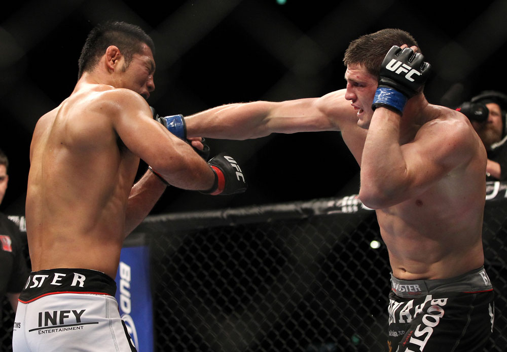 SAITAMA, JAPAN - FEBRUARY 26:  (R-L) Steve Cantwell punches Riki Fukuda during the UFC 144 event at Saitama Super Arena on February 26, 2012 in Saitama, Japan.  (Photo by Josh Hedges/Zuffa LLC/Zuffa LLC via Getty Images) *** Local Caption *** Riki Fukuda; Steve Cantwell