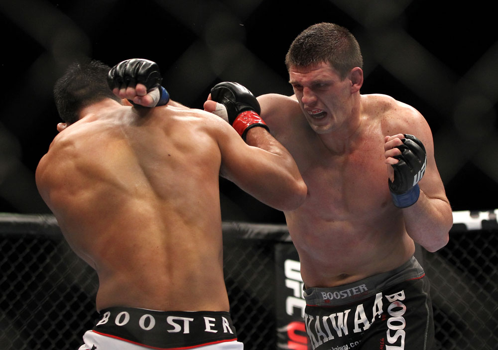 SAITAMA, JAPAN - FEBRUARY 26:  (R-L) Steve Cantwell punches Riki Fukuda during the UFC 144 event at Saitama Super Arena on February 26, 2012 in Saitama, Japan.  (Photo by Josh Hedges/Zuffa LLC/Zuffa LLC via Getty Images) *** Local Caption *** Riki Fukuda; Steve Cantwell
