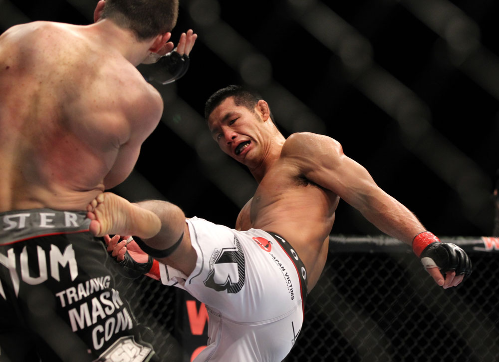 SAITAMA, JAPAN - FEBRUARY 26:  (R-L) RIki Fukuda kicks Steve Cantwell during the UFC 144 event at Saitama Super Arena on February 26, 2012 in Saitama, Japan.  (Photo by Josh Hedges/Zuffa LLC/Zuffa LLC via Getty Images) *** Local Caption *** Riki Fukuda; Steve Cantwell