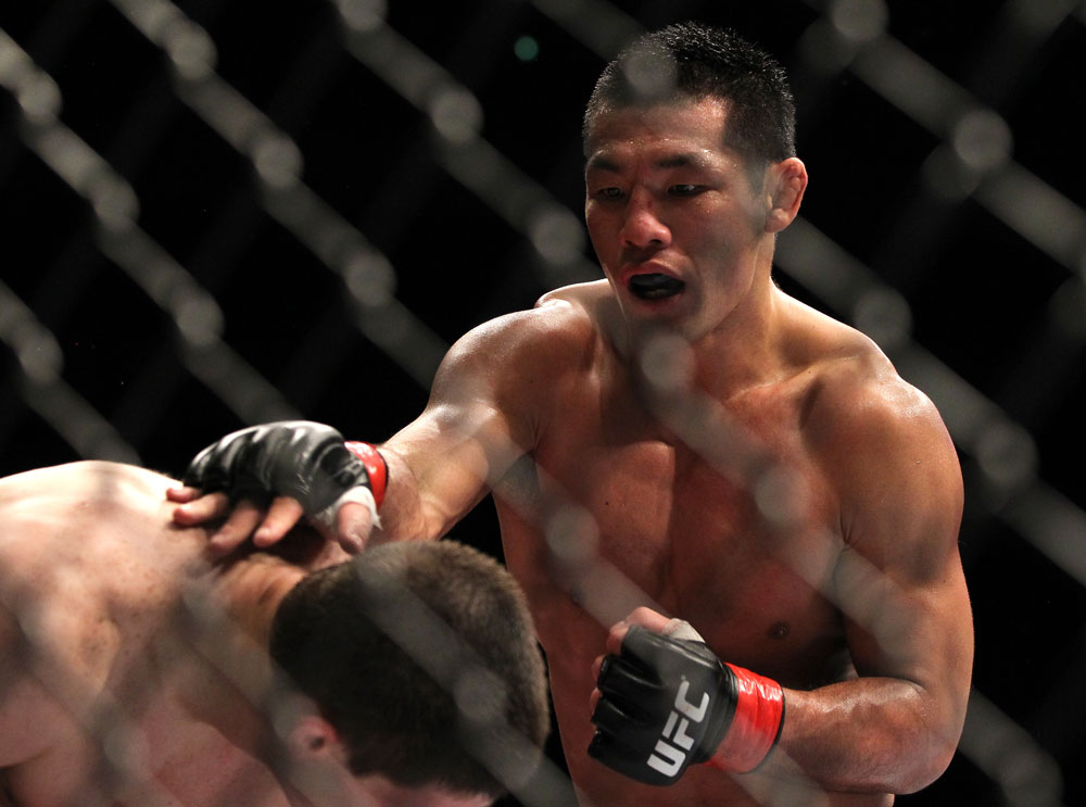 SAITAMA, JAPAN - FEBRUARY 26:  (R-L) RIki Fukuda punches Steve Cantwell during the UFC 144 event at Saitama Super Arena on February 26, 2012 in Saitama, Japan.  (Photo by Josh Hedges/Zuffa LLC/Zuffa LLC via Getty Images) *** Local Caption *** Riki Fukuda; Steve Cantwell