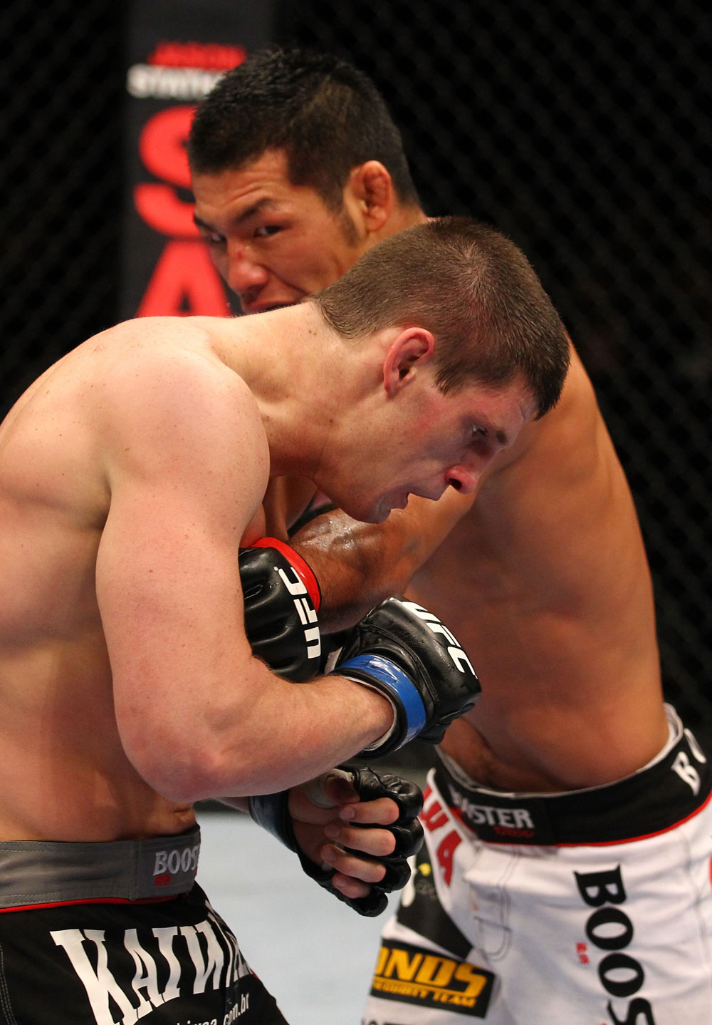 SAITAMA, JAPAN - FEBRUARY 26:  (R-L) RIki Fukuda punches Steve Cantwell during the UFC 144 event at Saitama Super Arena on February 26, 2012 in Saitama, Japan.  (Photo by Al Bello/Zuffa LLC/Zuffa LLC via Getty Images) *** Local Caption *** Riki Fukuda; Steve Cantwell