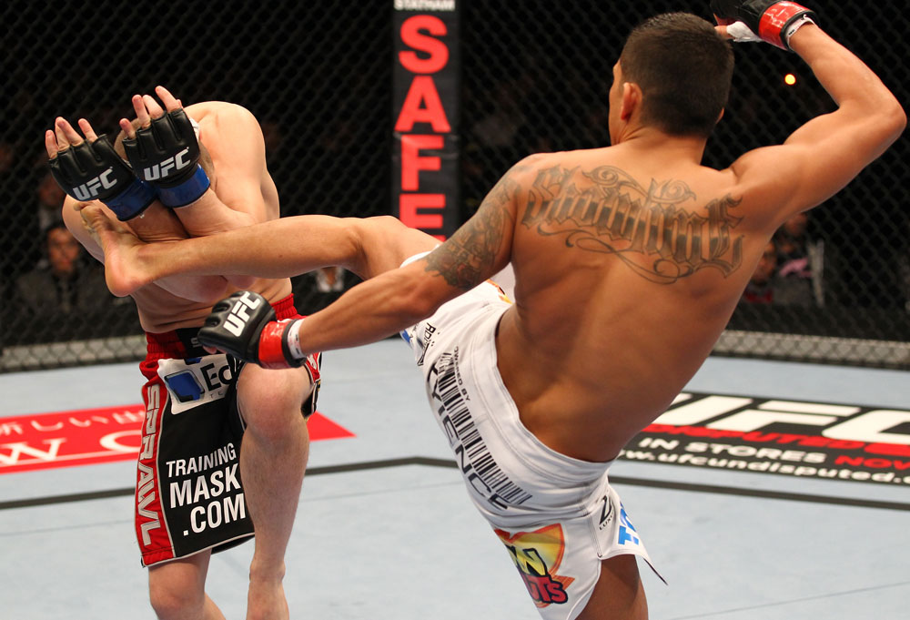 SAITAMA, JAPAN - FEBRUARY 26:  (R-L) Anthony Pettis kicks Joe Lauzon during the UFC 144 event at Saitama Super Arena on February 26, 2012 in Saitama, Japan.  (Photo by Al Bello/Zuffa LLC/Zuffa LLC via Getty Images) *** Local Caption *** Anthony Pettis; Joe Lauzon