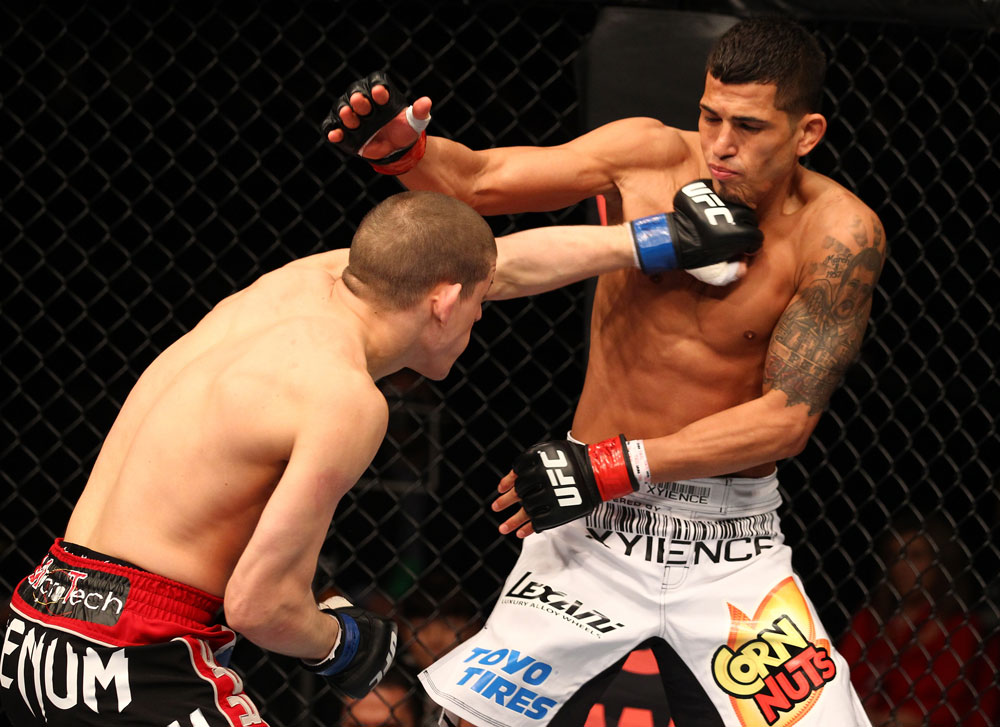 SAITAMA, JAPAN - FEBRUARY 26:  (L-R) Joe Lauzon punches Anthony Pettis during the UFC 144 event at Saitama Super Arena on February 26, 2012 in Saitama, Japan.  (Photo by Al Bello/Zuffa LLC/Zuffa LLC via Getty Images) *** Local Caption *** Anthony Pettis; Joe Lauzon